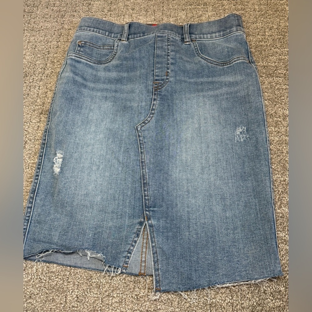 Spanx Distressed Denim Skirt in a light blue wash with front slit. Size small